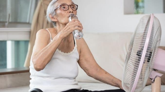 elderly-woman-drinking-bottle