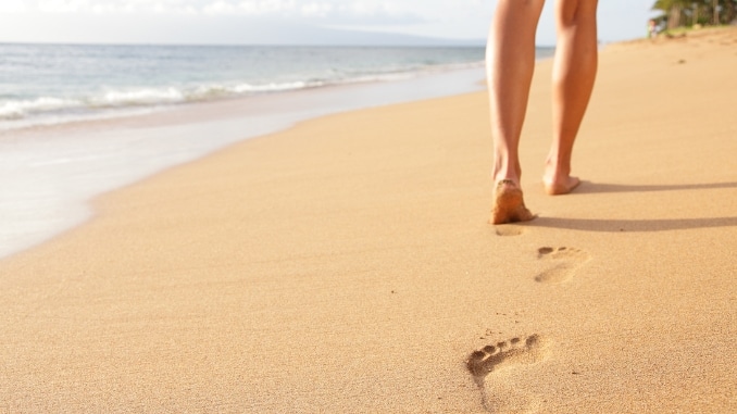 Why Beach Walking Burns More Calories Than Pavement Strolling